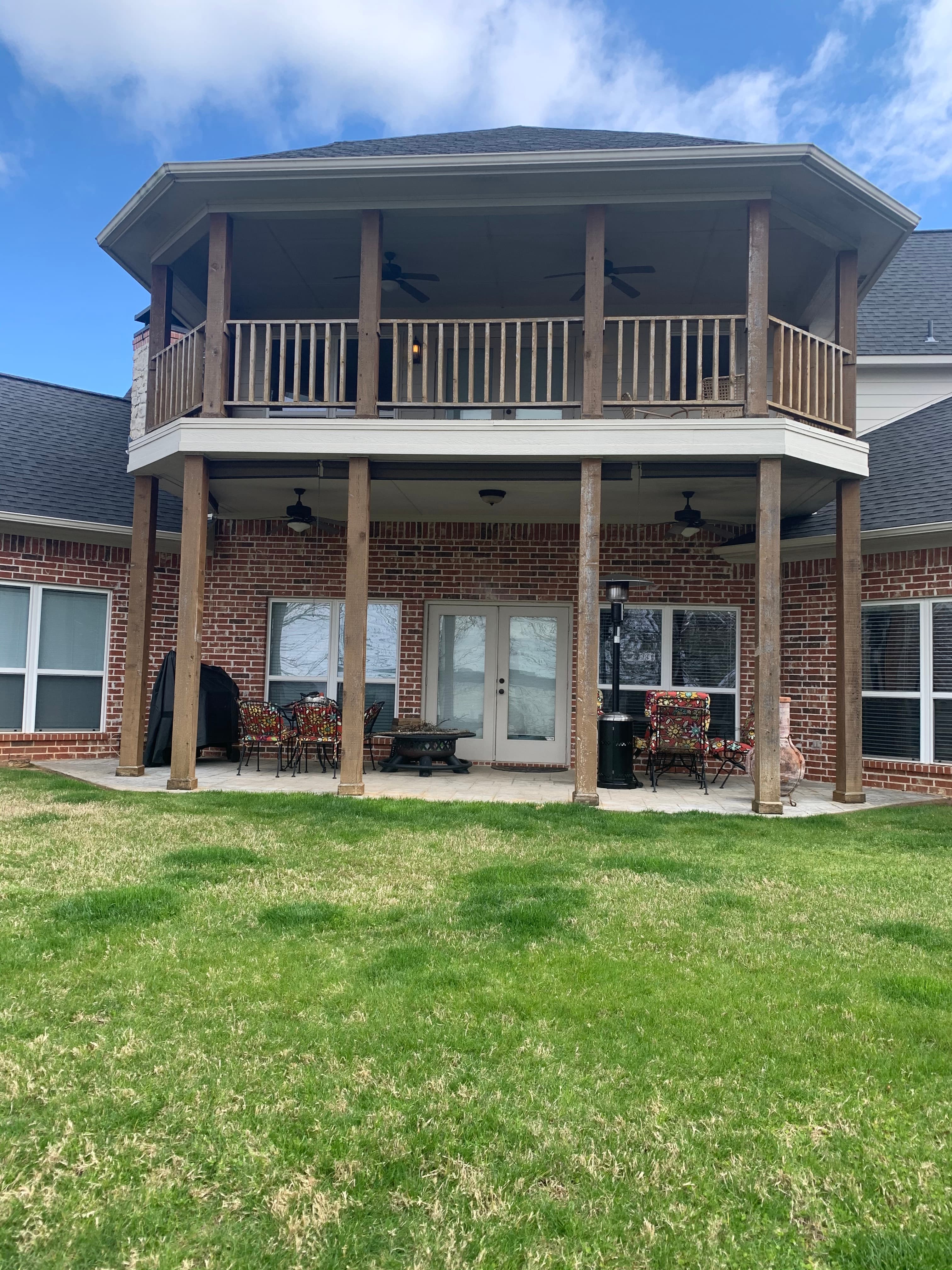 Another view of porch posts and wood railing before updates