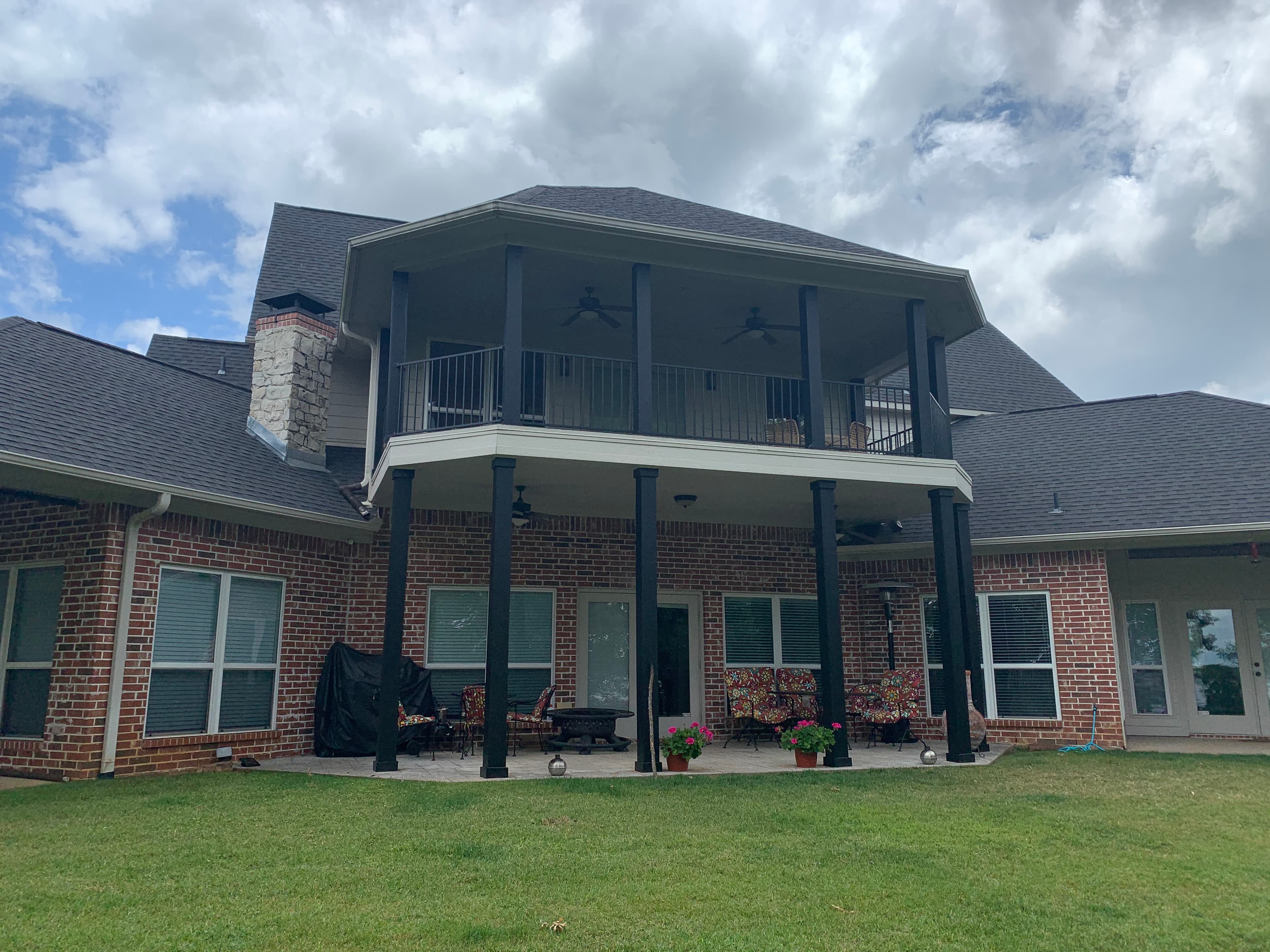 Wrapped porch posts and iron railing