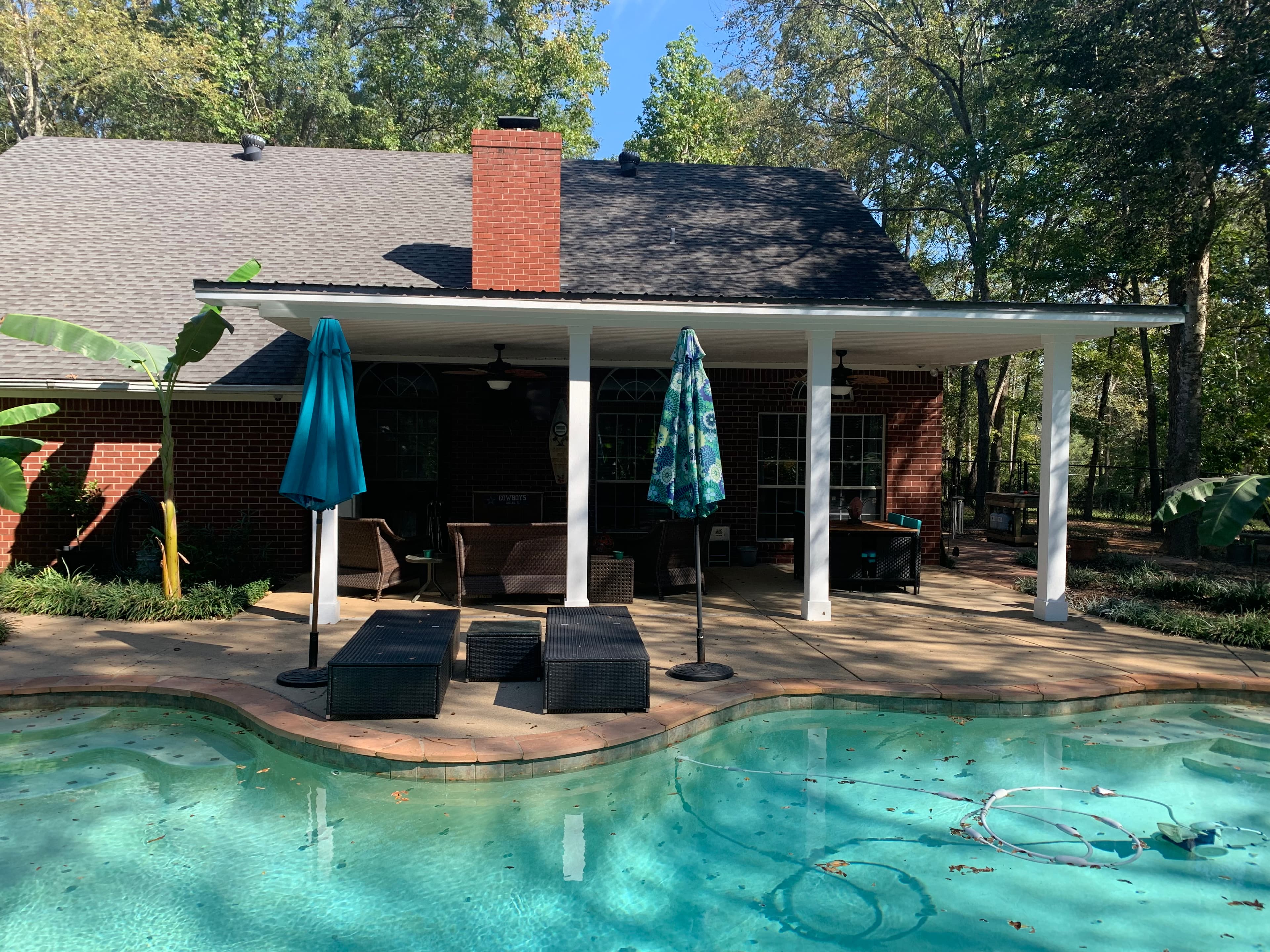 Covered patio beside the pool