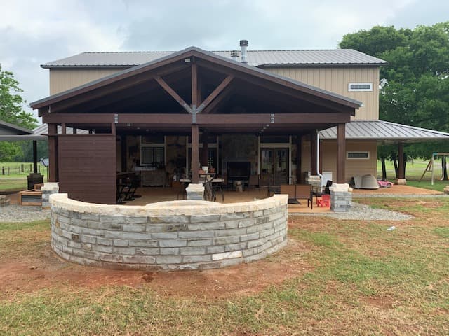 Another view of covered porch with fire pit