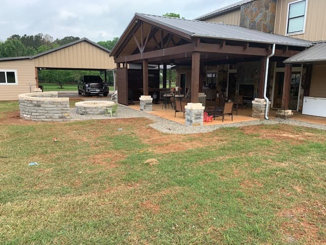 Yet another view of covered porch with fire pit