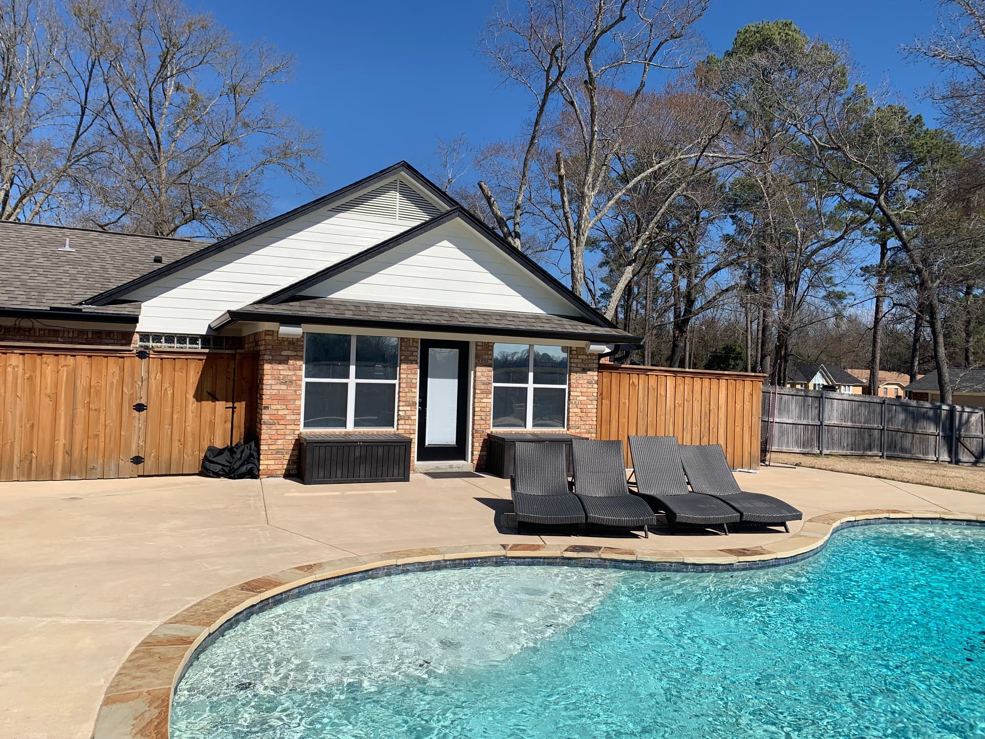 Remodeled exterior beside swimming pool