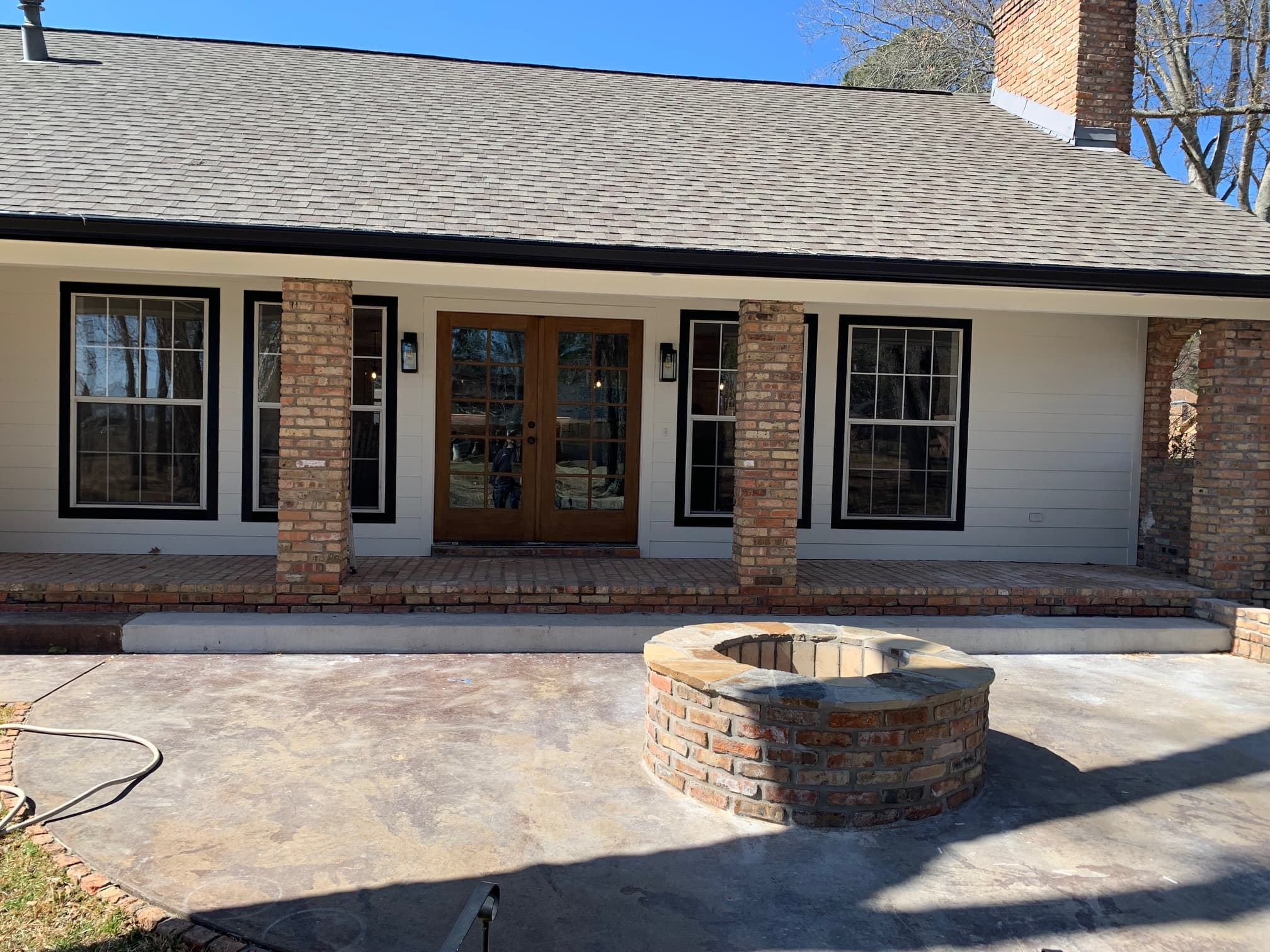 Remodeled exterior patio with firepit